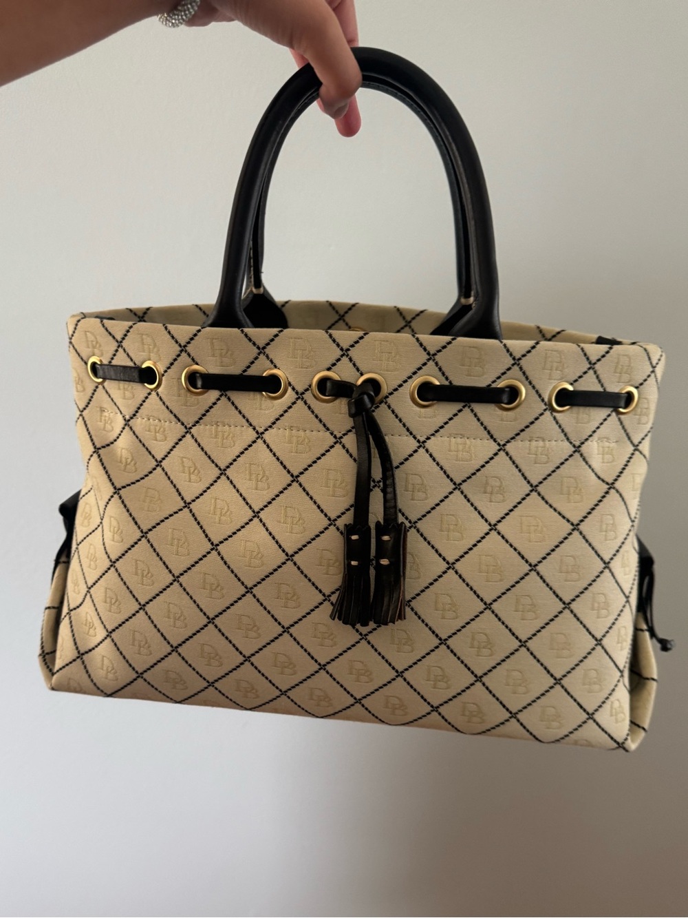 Dooney and Bourke Tassel Drawstring Top-Handle Tote in Cream and Black